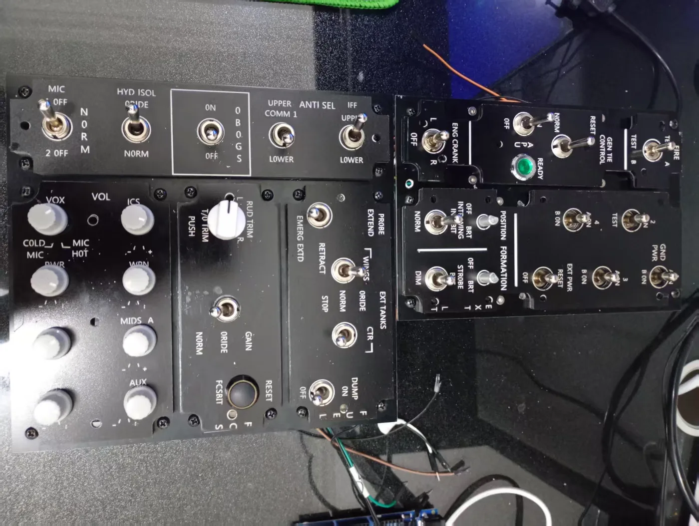 Pilot seated at the full F/A-18C simpit with both console panels